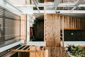 a room with wood paneling and a window at Through A Path in Tainan