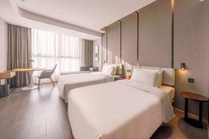 Katil atau katil-katil dalam bilik di Atour Hotel Luzhou Bubugao New World
