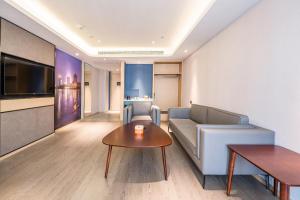 Televisyen dan/atau pusat hiburan di Atour Hotel Luzhou Bubugao New World