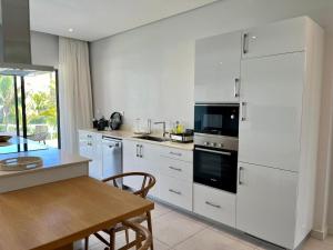 Cucina o angolo cottura di Turquoise Appart standing 2Ch Sdb, proche plages