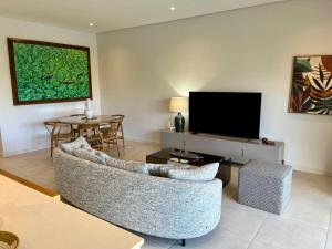 TV o dispositivi per l'intrattenimento presso Turquoise Appart standing 2Ch Sdb, proche plages