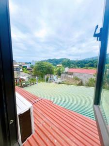 a view of a tennis court from a window at Bảo Ngọc Motel in Làng Me +6 photos