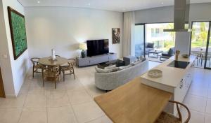 TV o dispositivi per l'intrattenimento presso Turquoise Appart standing 2Ch Sdb, proche plages
