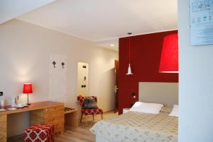 Posteľ alebo postele v izbe v ubytovaní Il Piccolo Dolomiti Resort