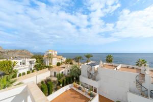 an aerial view of a white building and the ocean at Brisa de Mar in El Pozo del Esparto