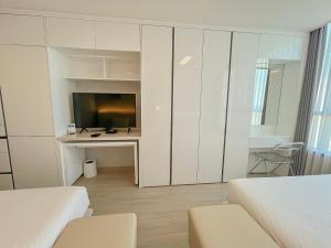 UH FLAT The SONGDO客房内的一张或多张床位