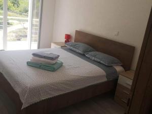 Un pat sau paturi într-o cameră la Apartments Kalajzic- Two Bedroom Apartment with Terrace A4 ST