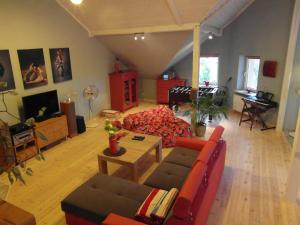 a living room with a couch and a table at Apartamenty Nad Zalewem in Nieporęt