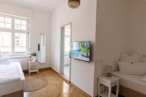 TV a/nebo společenská místnost v ubytování Gästehaus am Winckel