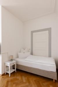 Postel nebo postele na pokoji v ubytování Gästehaus am Winckel
