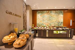 a buffet line with bread and pastries in a hotel at Waxwing Hotel in Hatay