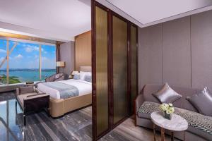 Letto o letti in una camera di Wyndham Grand Foshan Gaoming