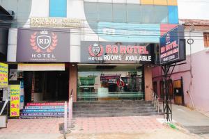 a facade of a hotel with stairs in front at Hotel RD in Perundurai