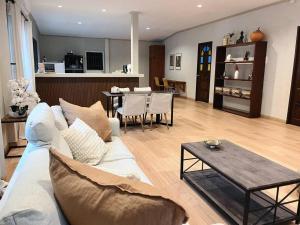 a living room with a couch and a table at Charming Getaway in Koh Chang in Ko Chang