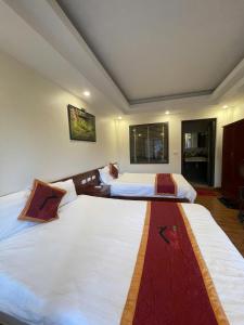 Postel nebo postele na pokoji v ubytování Son Ha Hotel SAPA