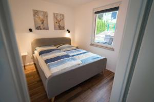 Postel nebo postele na pokoji v ubytování Ferienhaus Harzblüte