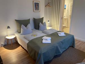 Postelja oz. postelje v sobi nastanitve Lønstrup Strandhotel