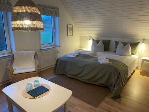 Postelja oz. postelje v sobi nastanitve Lønstrup Strandhotel
