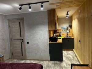 Kuchyň nebo kuchyňský kout v ubytování Міні Готель SPA Excellent Family
