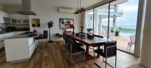 a kitchen with a large island with a counter top at Villa Monsoon in Nathon Bay