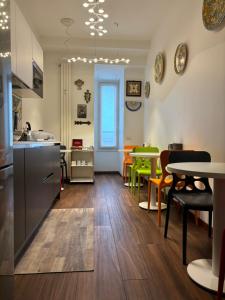 a kitchen and dining room with a table and chairs at Enjoy Milano Skyline in Milan