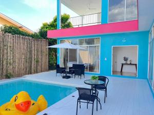 a house with a pool with a rubber duck in the backyard at Dream pool villa 3 in Bang Sare