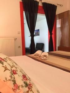 Postel nebo postele na pokoji v ubytování Apartments San