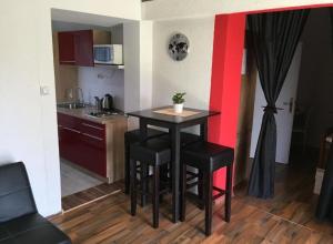 Kuchyň nebo kuchyňský kout v ubytování Apartments San