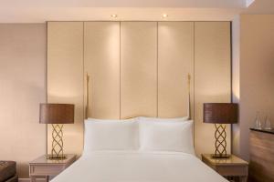 Dusit Princess Melaka客房内的一张或多张床位