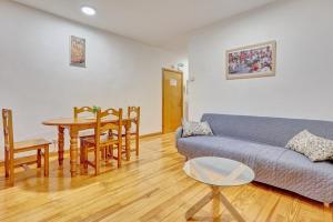 a living room with a couch and a table at Bajada de Javier by Clabao in Pamplona