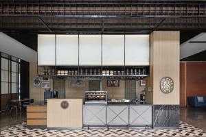 a large kitchen with a large chandelier in a building at Four Points by Sheraton Datong Pingcheng in Datong