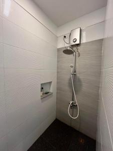 a bathroom with a shower in a wall at Txaleta de Camiguin desde 2024 in Mambajao +111 photos