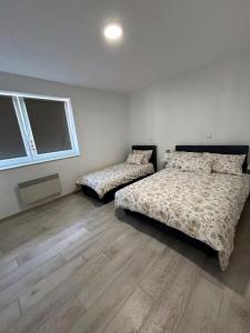 Postel nebo postele na pokoji v ubytování Rosa Canina Kupres 2 - Centar + 7 fotografií