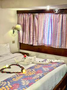 Voodi või voodid majutusasutuse Nile View Aton Cruise toas