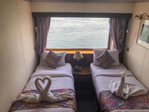 Voodi või voodid majutusasutuse Nile View Aton Cruise toas