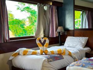 Voodi või voodid majutusasutuse Nile View Aton Cruise toas