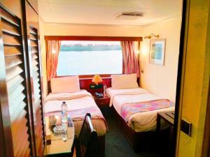 Voodi või voodid majutusasutuse Nile View Aton Cruise toas