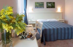 Postel nebo postele na pokoji v ubytování Hotel le Muse