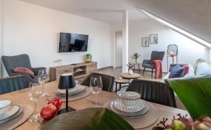 a living room with a table with wine glasses at Panorama Apartment I Aufzug I Stellplatz I Natur in Schwarzenberg (Erzgebirge)
