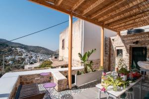 a balcony with a view of a city at Almond Blossom Cottage 1 in Philotium