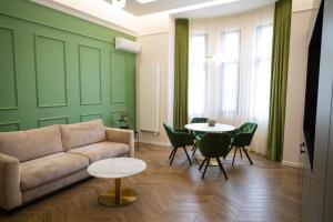 a living room with a couch and a table at PoshSpot Apartments in Cluj-Napoca