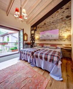 Ένα ή περισσότερα κρεβάτια σε δωμάτιο στο Casas La Xiuca