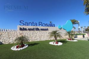 a rendering of two palm trees in front of a sign at Villa Almendro Santa Rosalia Lake and Life Resort by PREMIUM SPAIN PROPERTIES in Torre-Pacheco