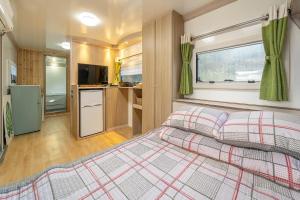 a bedroom with a large bed in a rv at Pocheon KidsGlampingGEO in Pocheon