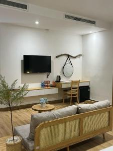 TV a/nebo společenská místnost v ubytování Triland Hotel