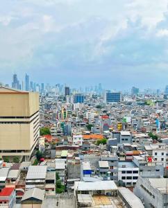 a view of a city with many buildings at Cozy Central Jakarta Apartment in Jakarta