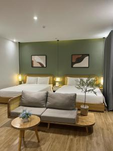 Postel nebo postele na pokoji v ubytování Triland Hotel