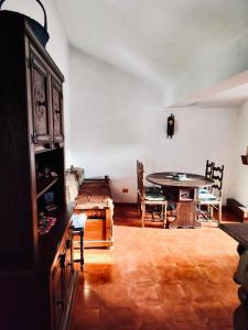 a living room with a table and a dining room at La Stella Alpina in Tagliacozzo