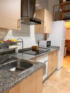 a kitchen with a sink and a counter top at InHome Central Studio in Montilla