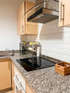 a kitchen with a sink and a counter top at InHome Central Studio in Montilla